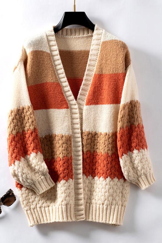 Woman wearing an oversized slouchy open-front knit cardigan with long sleeves