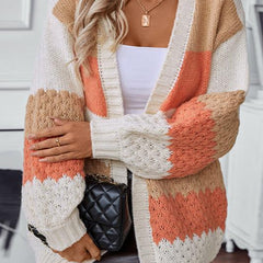 Woman wearing an oversized slouchy open-front knit cardigan with long sleeves