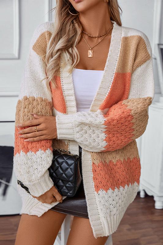 Woman wearing an oversized slouchy open-front knit cardigan with long sleeves