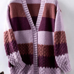 Woman wearing an oversized slouchy open-front knit cardigan with long sleeves