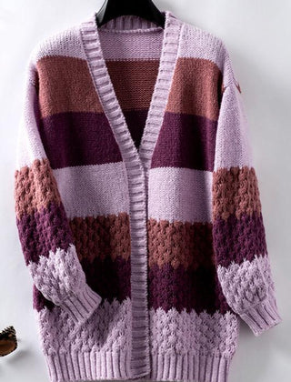 Woman wearing an oversized slouchy open-front knit cardigan with long sleeves