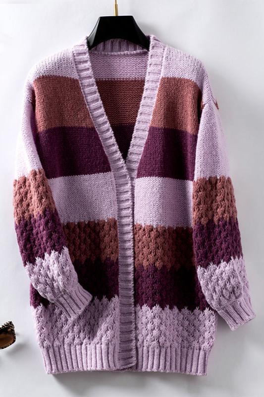 Woman wearing an oversized slouchy open-front knit cardigan with long sleeves