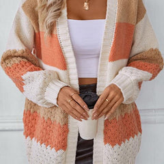 Woman wearing an oversized slouchy open-front knit cardigan with long sleeves