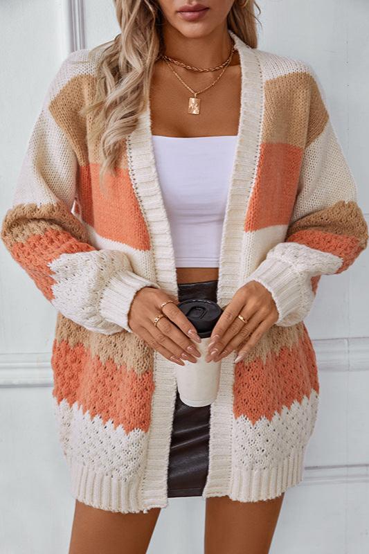 Woman wearing an oversized slouchy open-front knit cardigan with long sleeves