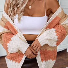 Woman wearing an oversized slouchy open-front knit cardigan with long sleeves