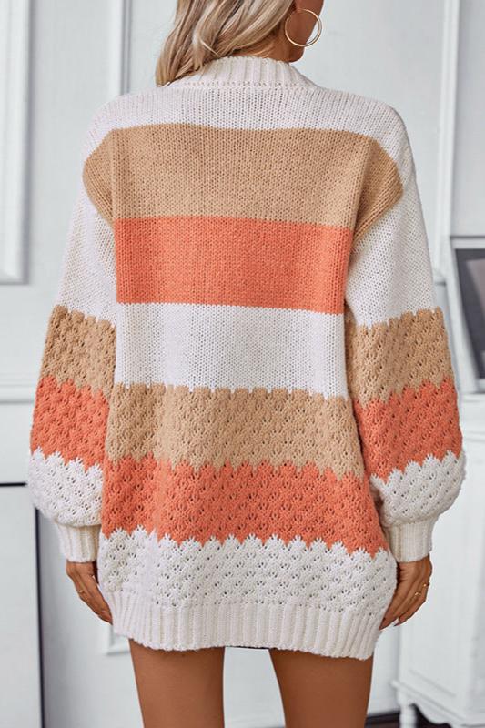 Woman wearing an oversized slouchy open-front knit cardigan with long sleeves