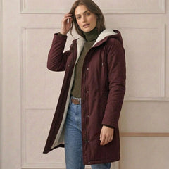 Women's cozy hooded longline coat with plush lining and front pockets