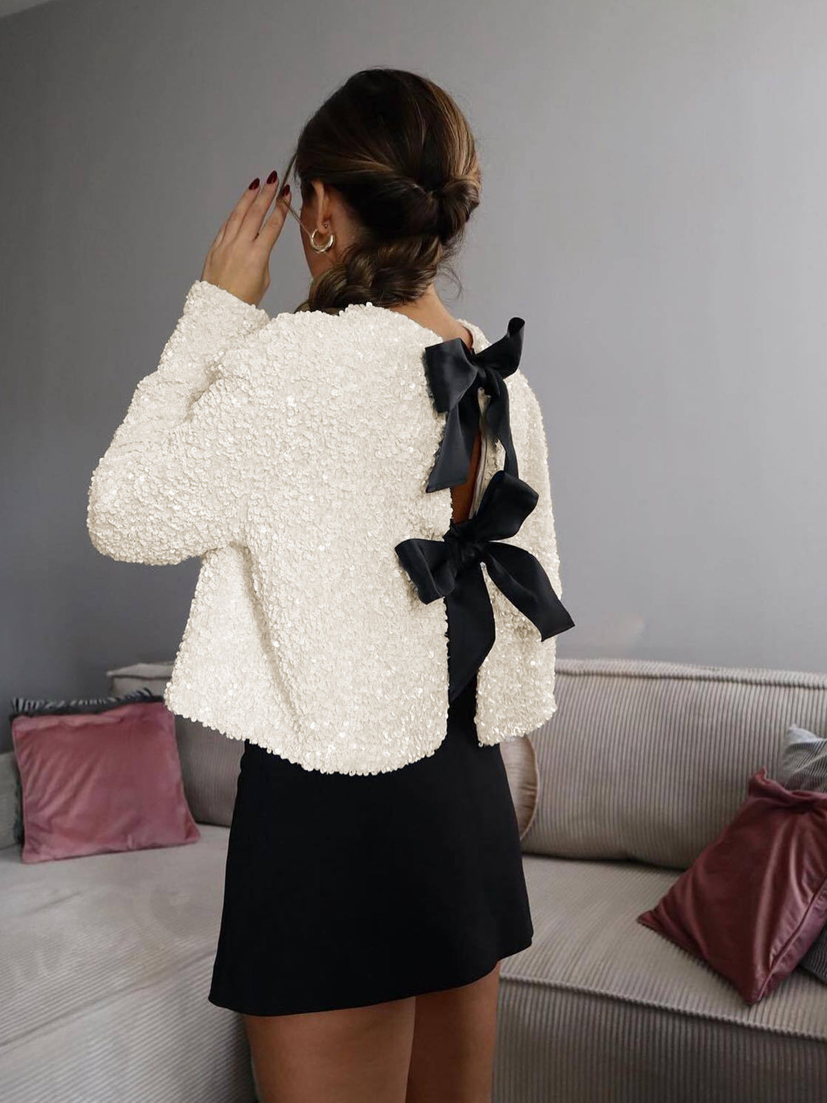 Beige textured sequin cropped jacket with oversized velvet bow detailing
