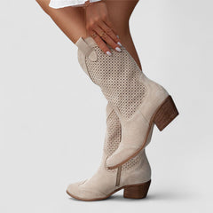 Perforated Western boots with pointed toe and block heel, shown in white, beige, black and brown