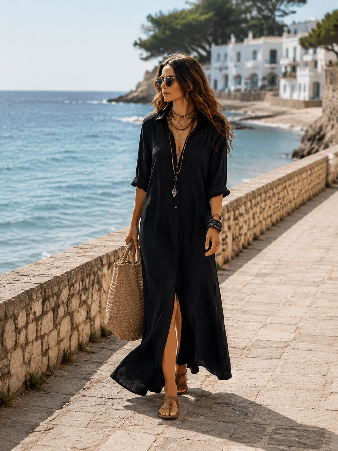 Woman wearing a black button-front bohemian shirt maxi dress with a flowy silhouette