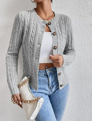 Cropped cable knit button-front cardigan with long sleeves, shown in a neutral tone