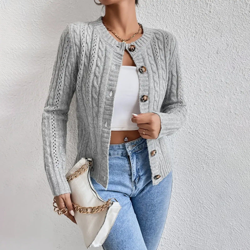 Cropped cable knit button-front cardigan with long sleeves, shown in a neutral tone