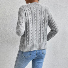 Cropped cable knit button-front cardigan with long sleeves, shown in a neutral tone