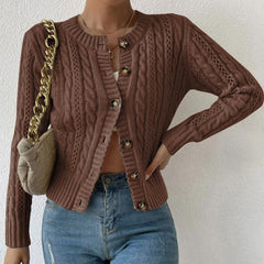 Cropped cable knit button-front cardigan with long sleeves, shown in a neutral tone