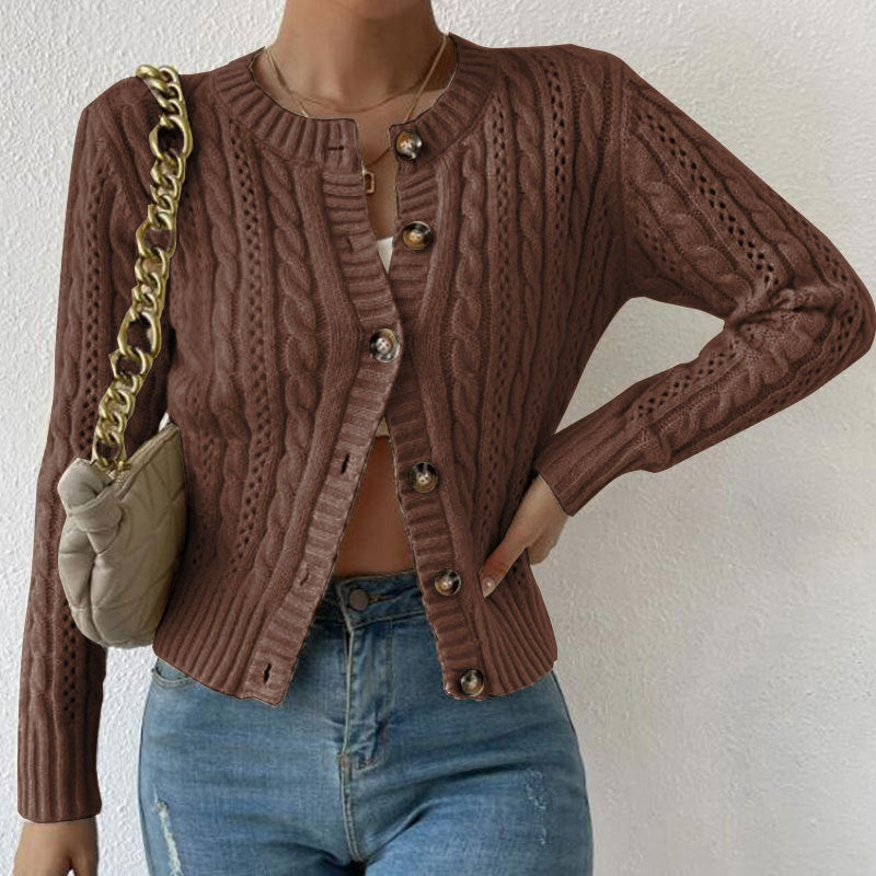 Cropped cable knit button-front cardigan with long sleeves, shown in a neutral tone