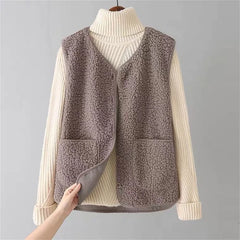 Women's matching set with button-front sleeveless vest and long-sleeve top in a neutral tone