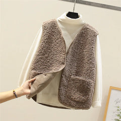 Women's matching set with button-front sleeveless vest and long-sleeve top in a neutral tone