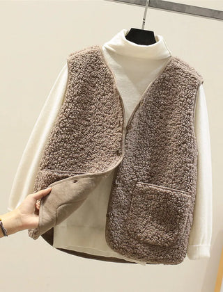 Women's matching set with button-front sleeveless vest and long-sleeve top in a neutral tone