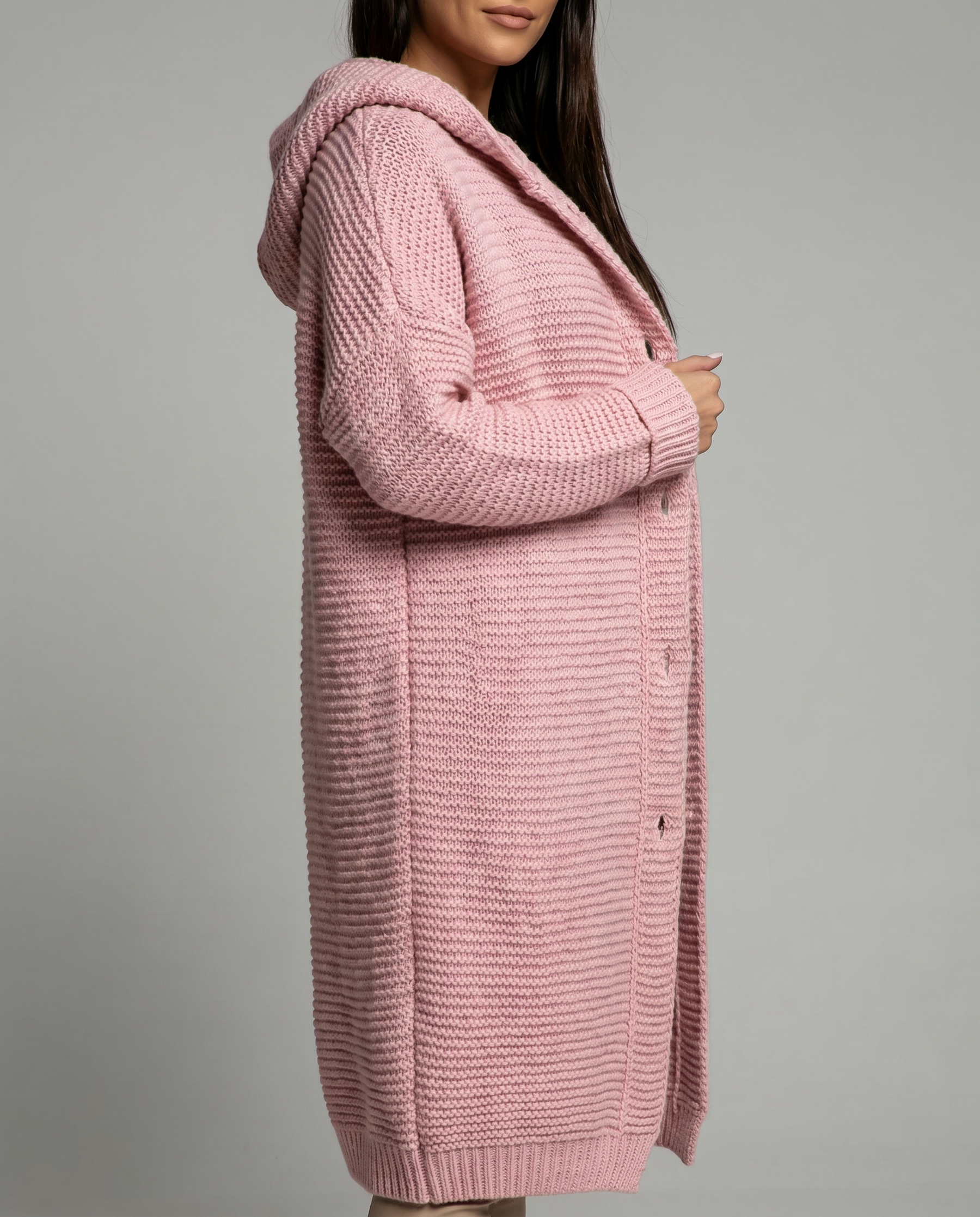 Women's hooded oversized chunky knit cardigan with large buttons in a soft neutral shade