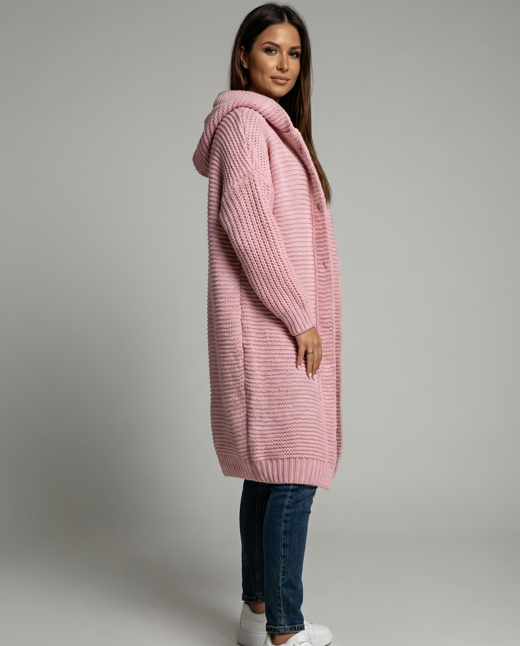 Women's hooded oversized chunky knit cardigan with large buttons in a soft neutral shade