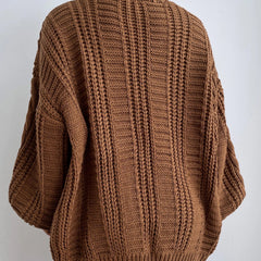 Oversized cable knit cardigan with dropped shoulders, slouchy sleeves and ribbed trim