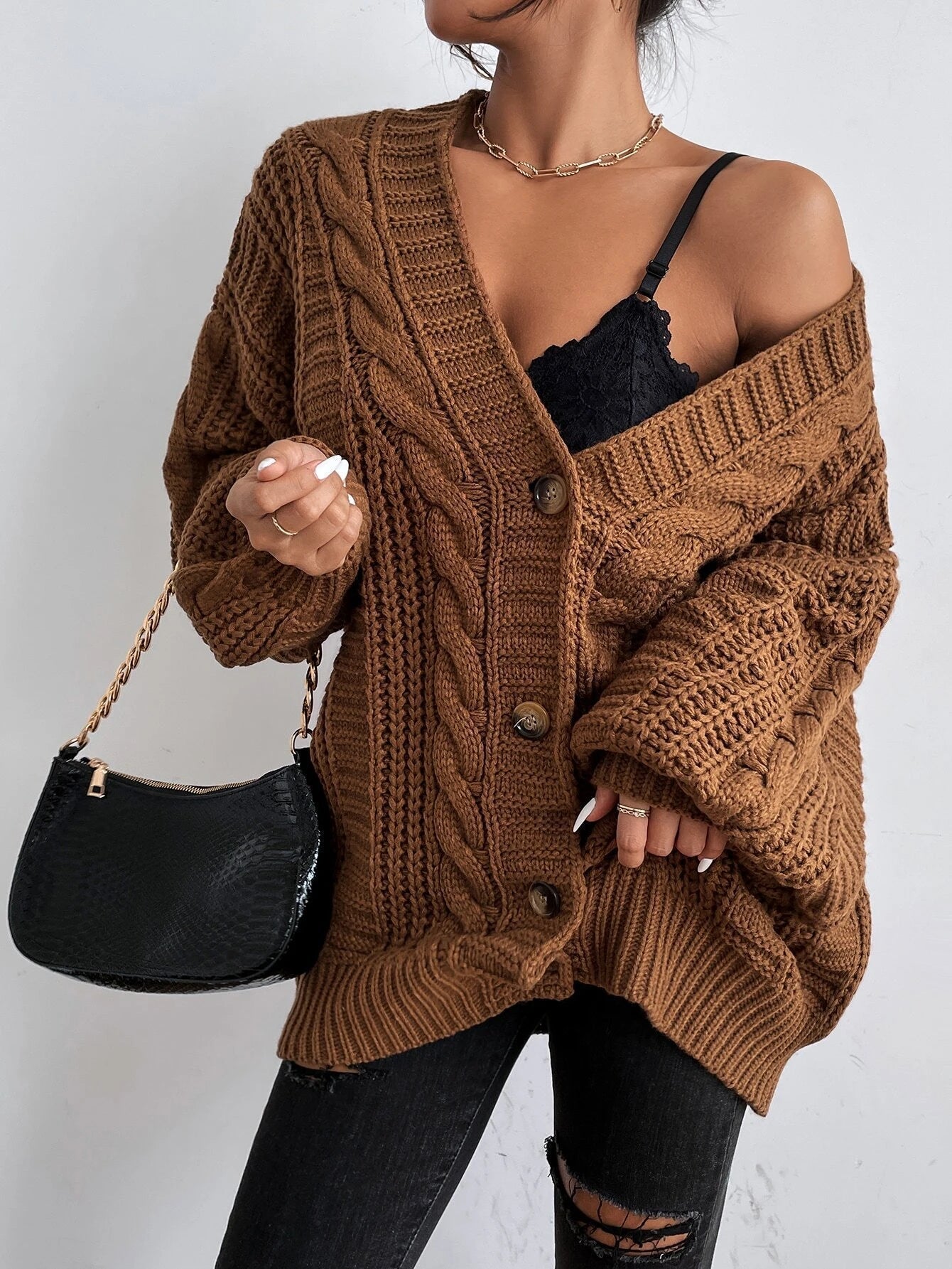 Oversized cable knit cardigan with dropped shoulders, slouchy sleeves and ribbed trim