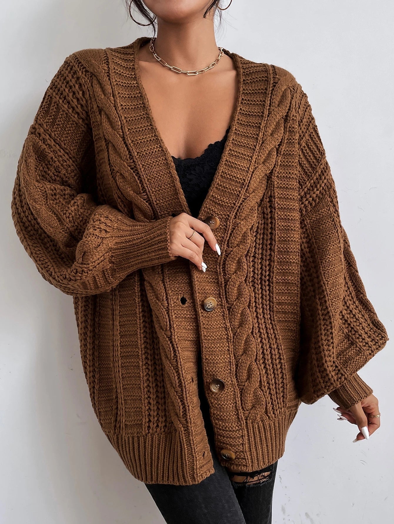Oversized cable knit cardigan with dropped shoulders, slouchy sleeves and ribbed trim