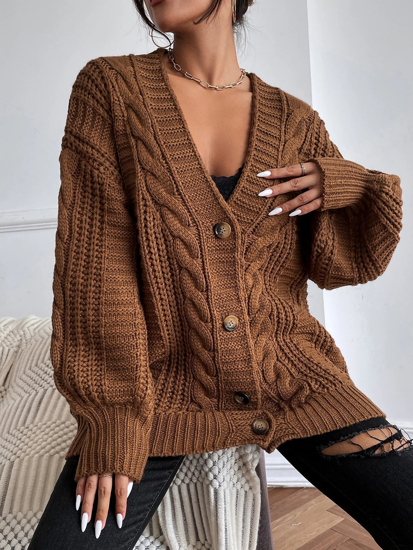 Oversized cable knit cardigan with dropped shoulders, slouchy sleeves and ribbed trim