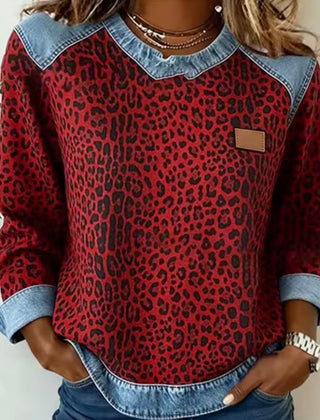 Leopard print sweater with contrast denim collar, cuffs, and hem in grey and red
