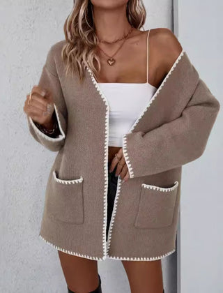 Open front long sleeve knit cardigan with front pockets in a relaxed drape