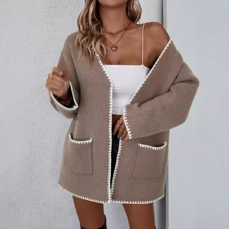 Open front long sleeve knit cardigan with front pockets in a relaxed drape