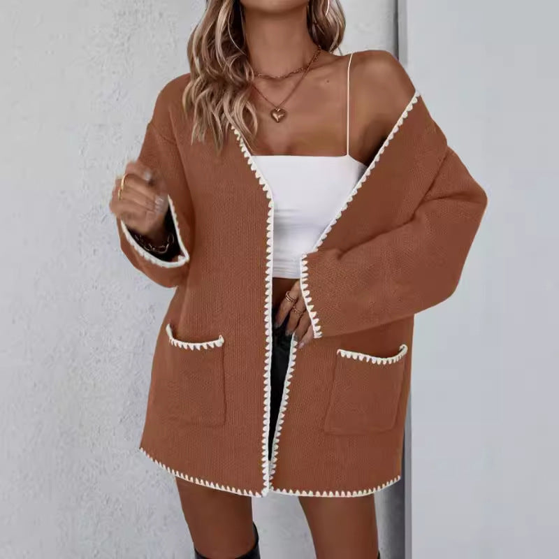 Open front long sleeve knit cardigan with front pockets in a relaxed drape