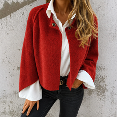 Woman wearing a soft cropped faux cashmere jacket with a snap front closure