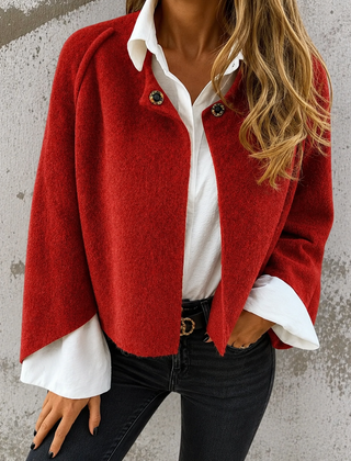 Woman wearing a soft cropped faux cashmere jacket with a snap front closure