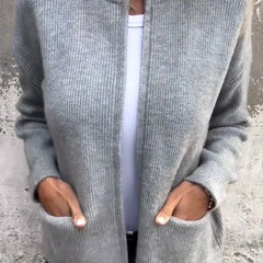 Women's minimal knit cardigan with front pockets in a neutral tone