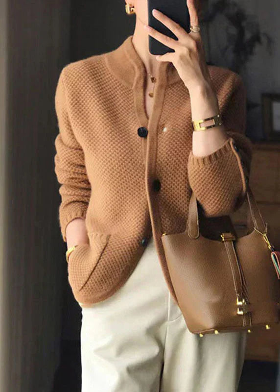 Woman wearing a soft open-front knit cardigan in camel with long sleeves and relaxed drape