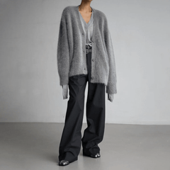 Fluffy knit cardigan with deep V-neck and oversized sleeves in neutral tones