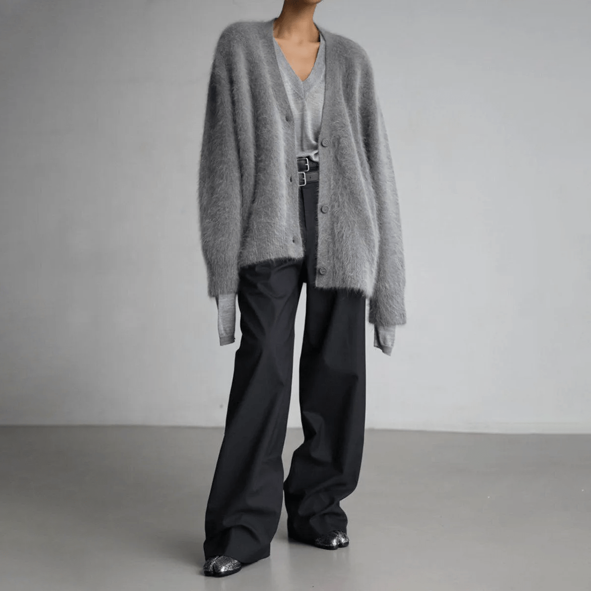 Fluffy knit cardigan with deep V-neck and oversized sleeves in neutral tones