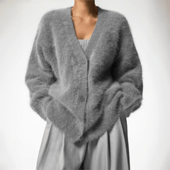 Fluffy knit cardigan with deep V-neck and oversized sleeves in neutral tones