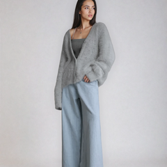 Fluffy knit cardigan with deep V-neck and oversized sleeves in neutral tones