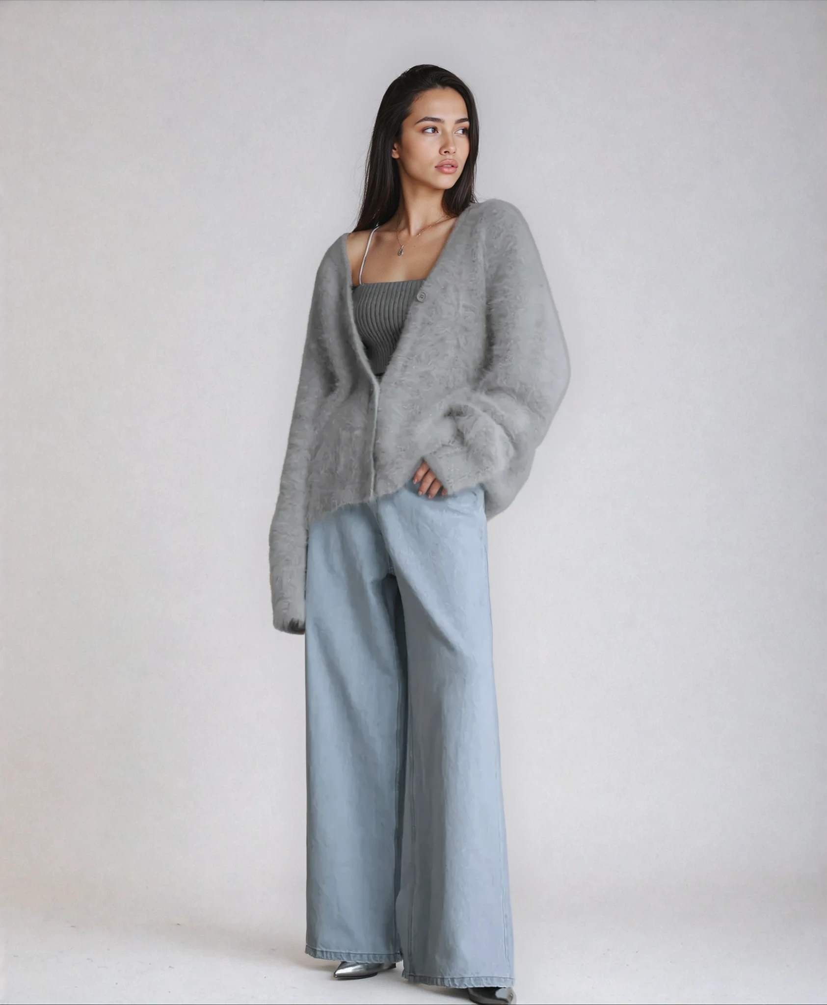 Fluffy knit cardigan with deep V-neck and oversized sleeves in neutral tones