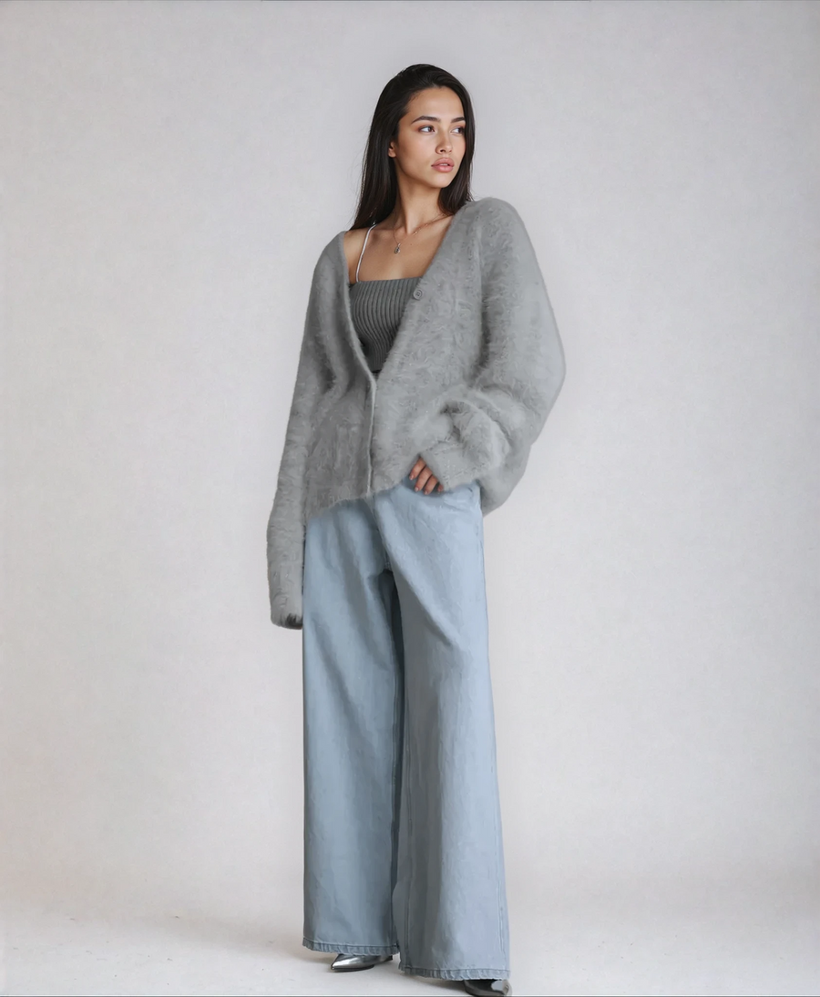 Fluffy knit cardigan with deep V-neck and oversized sleeves in neutral tones
