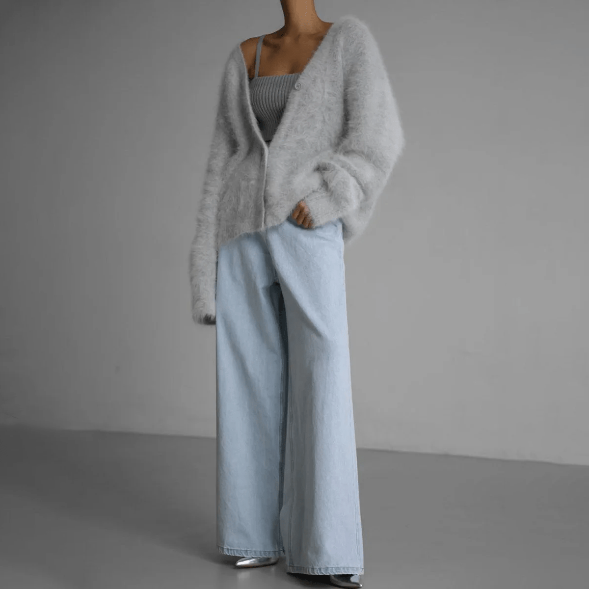 Fluffy knit cardigan with deep V-neck and oversized sleeves in neutral tones