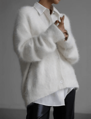 Fluffy knit cardigan with deep V-neck and oversized sleeves in neutral tones