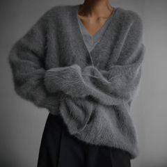 Fluffy knit cardigan with deep V-neck and oversized sleeves in neutral tones