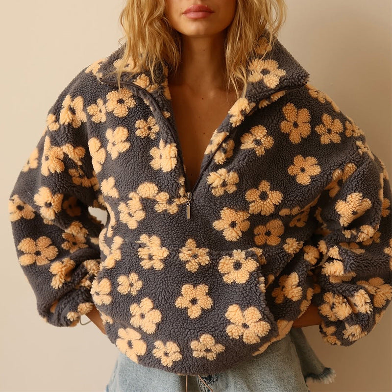 Women's floral quarter-zip sweater with stand collar and gathered cuffs in a relaxed fit