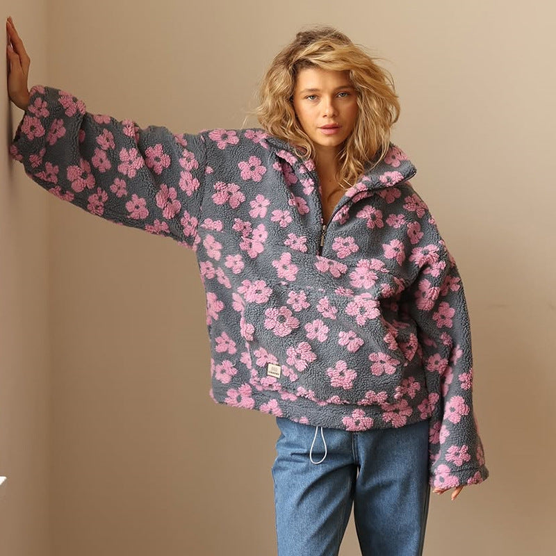 Women's floral quarter-zip sweater with stand collar and gathered cuffs in a relaxed fit