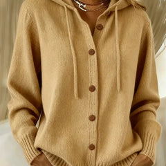 Woman wearing a soft hooded button-up cardigan with drawstring hood and ribbed cuffs