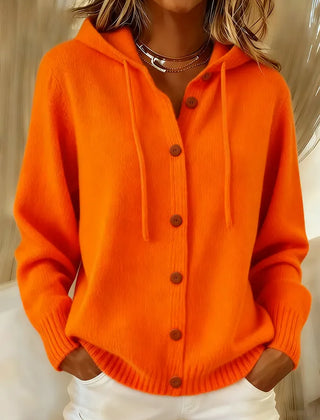 Woman wearing a soft hooded button-up cardigan with drawstring hood and ribbed cuffs