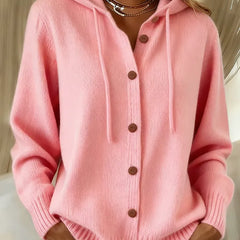Woman wearing a soft button-front cardigan hoodie with drawstring hood and ribbed cuffs